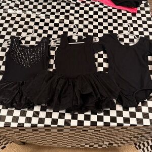 Three dancewear leotard pieces for girls, all black, size 110.
